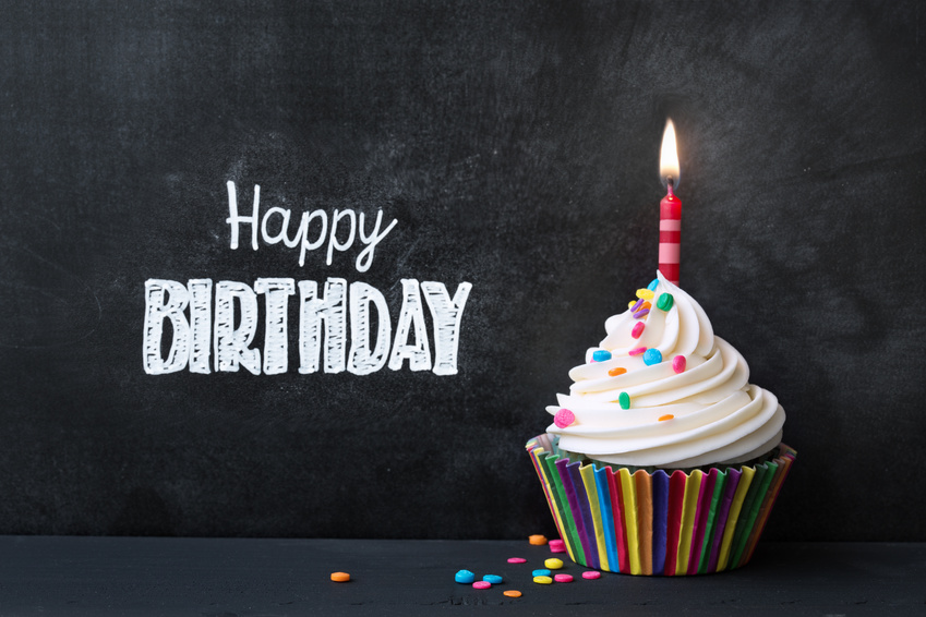 Birthday cupcake in front of a chalkboard